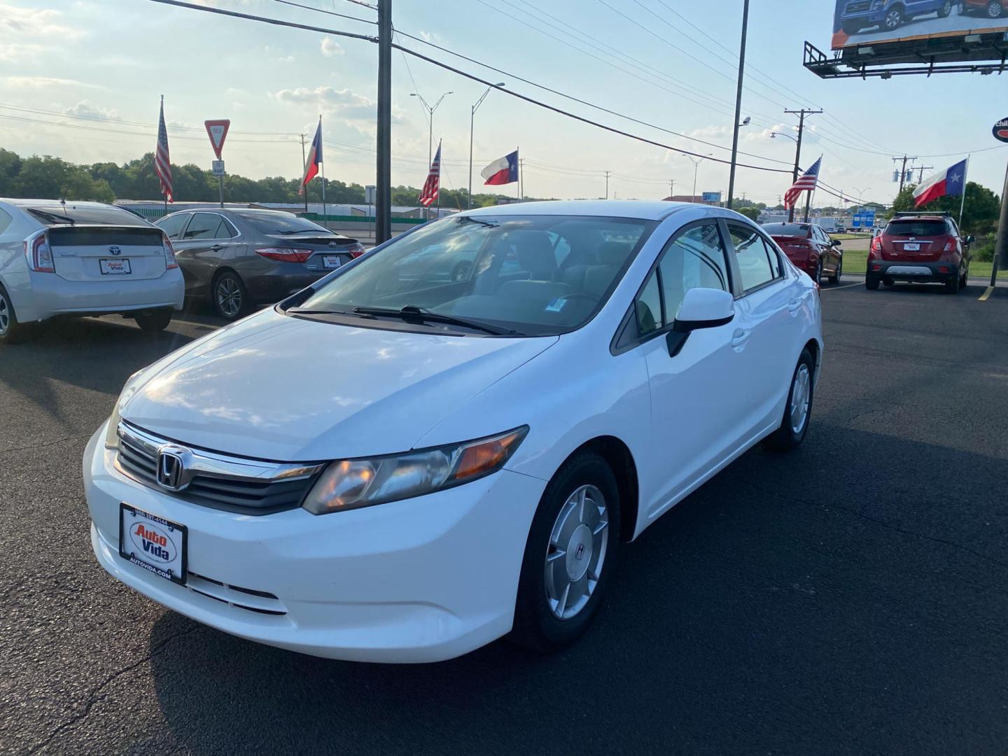 2012 WHITE Honda Civic HF Sedan 5-Speed AT (2HGFB2F61CH) with an 1.8L L4 SOHC 16V engine, 5-Speed Automatic transmission, located at 420 I-35E, Lancaster, TX, 75146, (469) 297-4144, 32.593929, -96.823685 - Photo#1