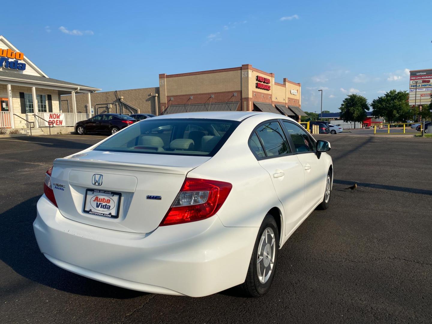 2012 WHITE Honda Civic HF Sedan 5-Speed AT (2HGFB2F61CH) with an 1.8L L4 SOHC 16V engine, 5-Speed Automatic transmission, located at 420 I-35E, Lancaster, TX, 75146, (469) 297-4144, 32.593929, -96.823685 - Photo#5