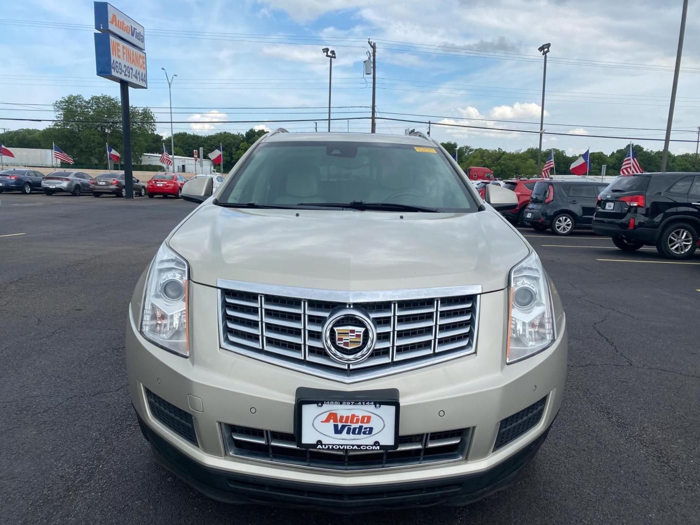 2015 TAN Cadillac SRX Luxury Collection FWD (3GYFNBE30FS) with an 3.6L V6 DOHC 24V FFV engine, 6-Speed Automatic transmission, located at 420 I-35E, Lancaster, TX, 75146, (469) 297-4144, 32.593929, -96.823685 - Photo#0