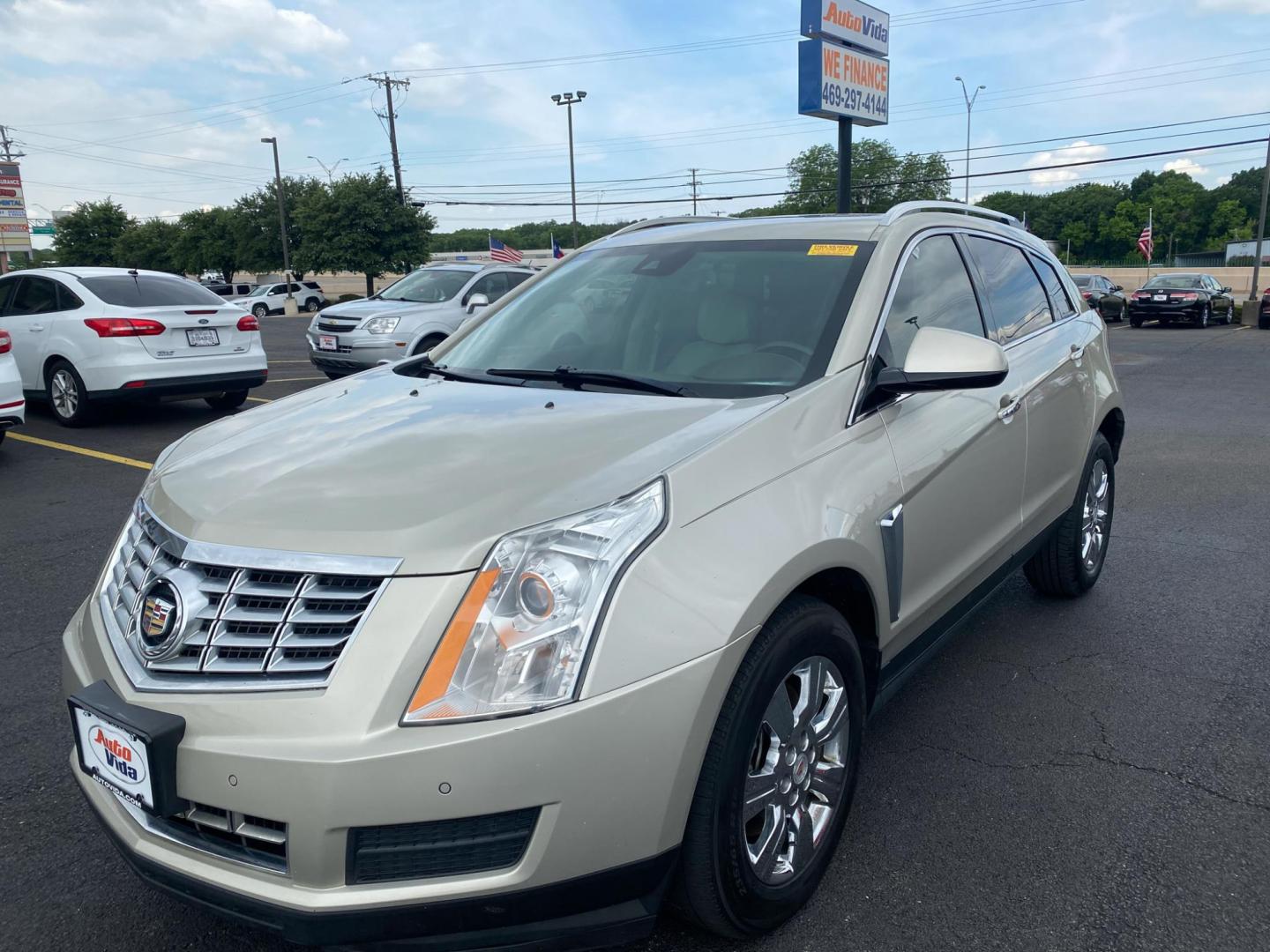 2015 TAN Cadillac SRX Luxury Collection FWD (3GYFNBE30FS) with an 3.6L V6 DOHC 24V FFV engine, 6-Speed Automatic transmission, located at 420 I-35E, Lancaster, TX, 75146, (469) 297-4144, 32.593929, -96.823685 - Photo#1