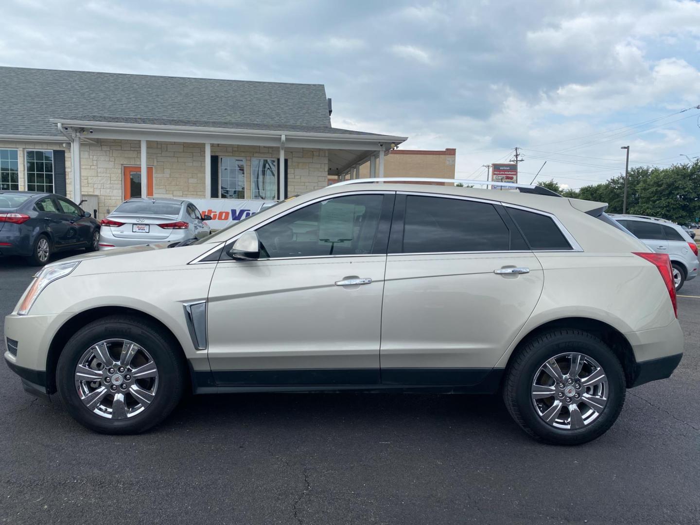 2015 TAN Cadillac SRX Luxury Collection FWD (3GYFNBE30FS) with an 3.6L V6 DOHC 24V FFV engine, 6-Speed Automatic transmission, located at 420 I-35E, Lancaster, TX, 75146, (469) 297-4144, 32.593929, -96.823685 - Photo#2