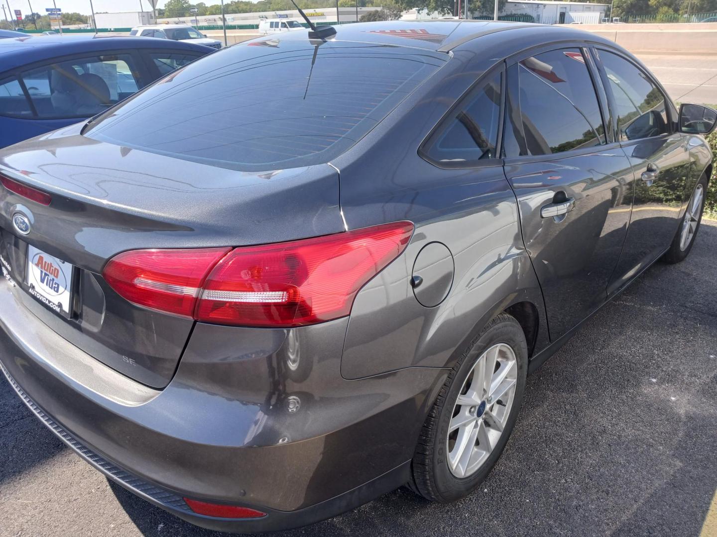 2018 GRAY Ford Focus SE Sedan (1FADP3F21JL) with an 2.0L L4 DOHC 16V engine, located at 420 I-35E, Lancaster, TX, 75146, (469) 297-4144, 32.593929, -96.823685 - Photo#1