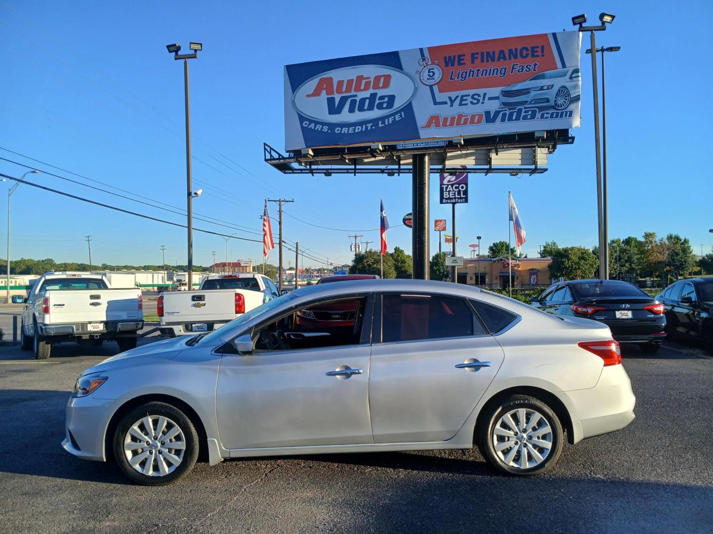 2016 SILVER Nissan Sentra FE+ S (3N1AB7AP6GY) with an 1.8L L4 SFI DOHC 16V engine, CVT transmission, located at 420 I-35E, Lancaster, TX, 75146, (469) 297-4144, 32.593929, -96.823685 - Photo#1