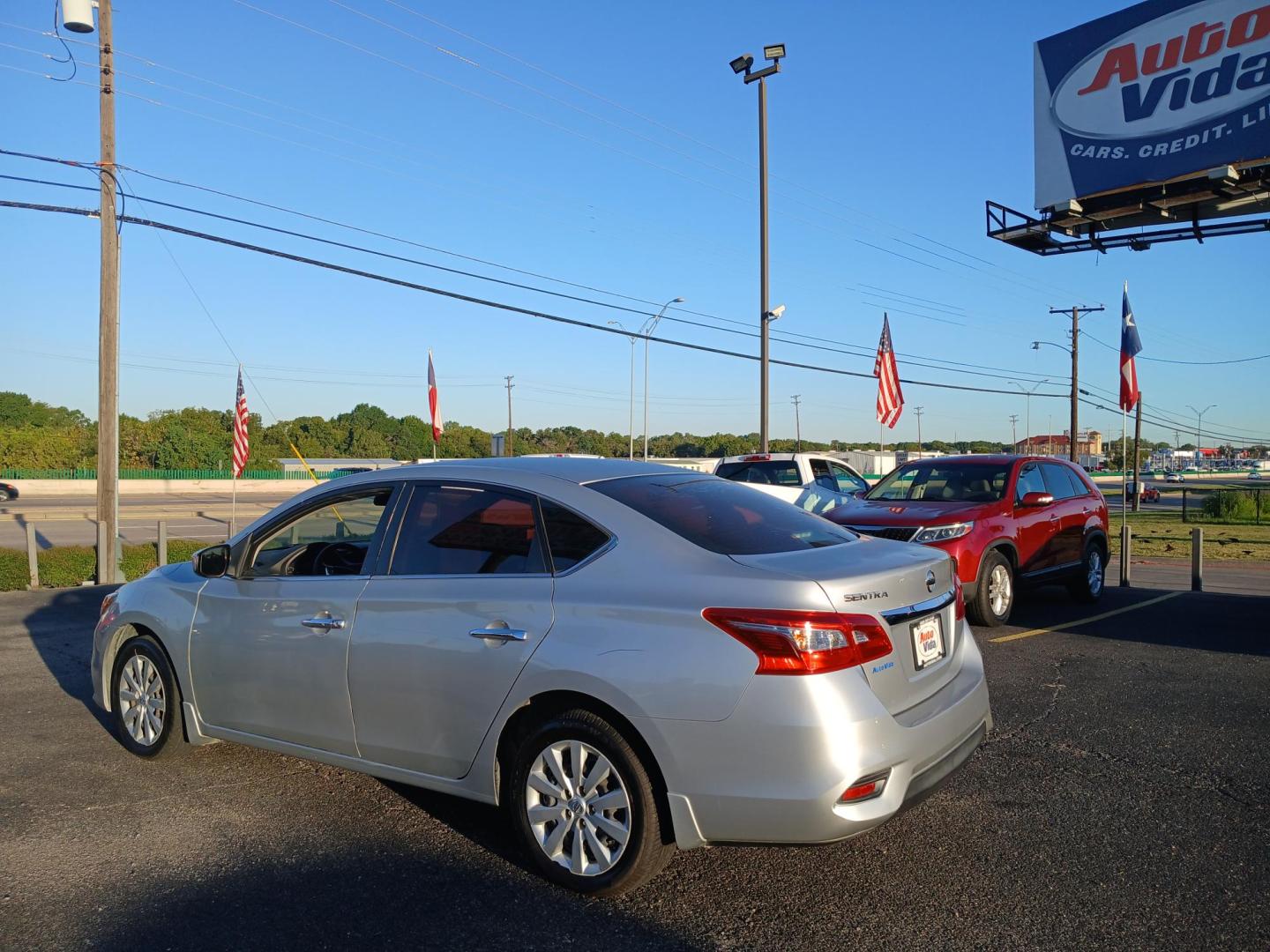 2016 SILVER Nissan Sentra FE+ S (3N1AB7AP6GY) with an 1.8L L4 SFI DOHC 16V engine, CVT transmission, located at 420 I-35E, Lancaster, TX, 75146, (469) 297-4144, 32.593929, -96.823685 - Photo#2