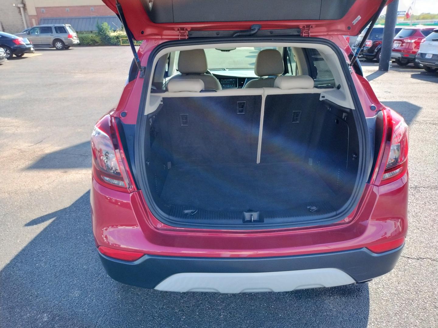 2017 RED Buick Encore Essence FWD (KL4CJCSB6HB) with an 1.4L L4 DOHC 16V TURBO engine, 6A transmission, located at 420 I-35E, Lancaster, TX, 75146, (469) 297-4144, 32.593929, -96.823685 - Photo#3