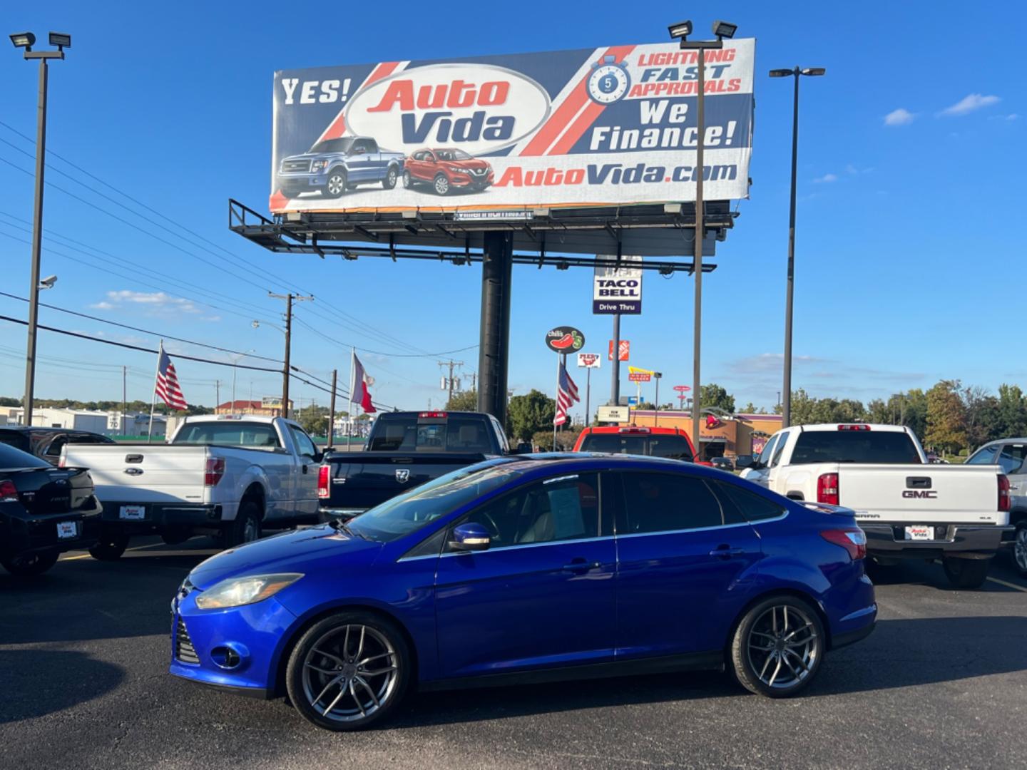 2014 BLUE Ford Focus Titanium Sedan (1FADP3J25EL) with an 2.0L L4 DOHC 16V engine, located at 420 I-35E, Lancaster, TX, 75146, (469) 297-4144, 32.593929, -96.823685 - Photo#0