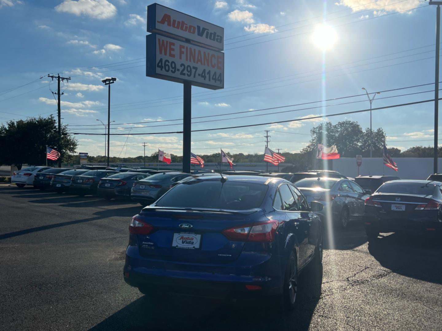 2014 BLUE Ford Focus Titanium Sedan (1FADP3J25EL) with an 2.0L L4 DOHC 16V engine, located at 420 I-35E, Lancaster, TX, 75146, (469) 297-4144, 32.593929, -96.823685 - Photo#5