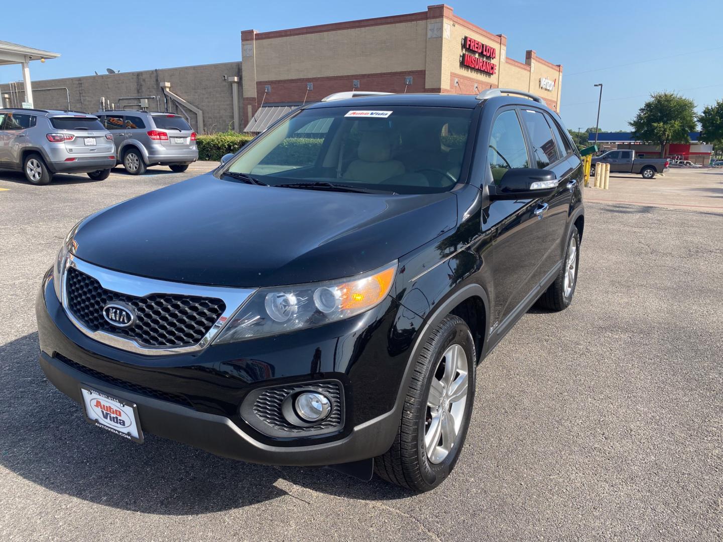 2012 BLACK Kia Sorento EX 4WD (5XYKUCA62CG) with an 2.4L L4 DOHC 16V engine, 6-Speed Automatic transmission, located at 420 I-35E, Lancaster, TX, 75146, (469) 297-4144, 32.593929, -96.823685 - Photo#5