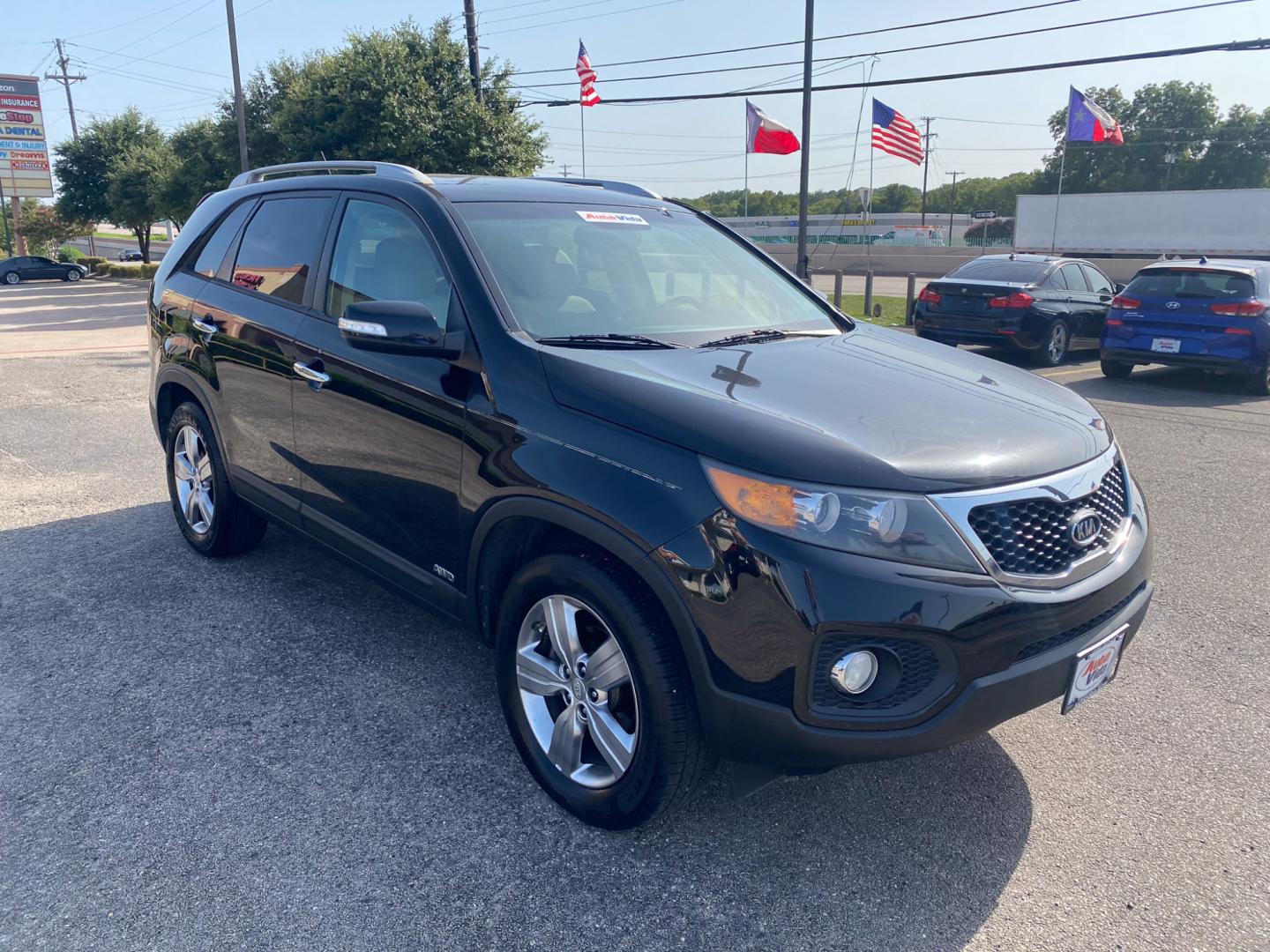 2012 BLACK Kia Sorento EX 4WD (5XYKUCA62CG) with an 2.4L L4 DOHC 16V engine, 6-Speed Automatic transmission, located at 420 I-35E, Lancaster, TX, 75146, (469) 297-4144, 32.593929, -96.823685 - Photo#1