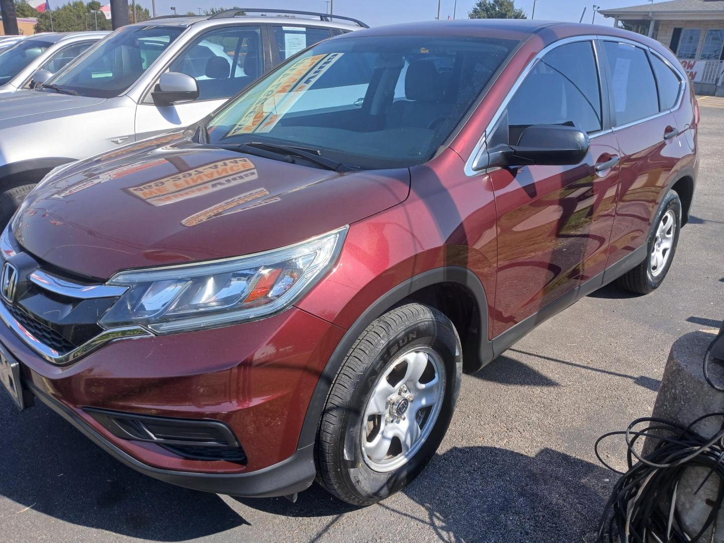 2015 RED Honda CR-V LX 2WD (2HKRM3H31FH) with an 2.4L L4 DOHC 16V engine, Continuously Variable Transmission transmission, located at 420 I-35E, Lancaster, TX, 75146, (469) 297-4144, 32.593929, -96.823685 - Photo#0