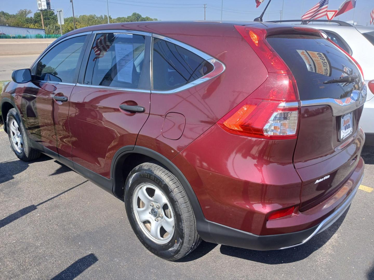 2015 RED Honda CR-V LX 2WD (2HKRM3H31FH) with an 2.4L L4 DOHC 16V engine, Continuously Variable Transmission transmission, located at 420 I-35E, Lancaster, TX, 75146, (469) 297-4144, 32.593929, -96.823685 - Photo#1