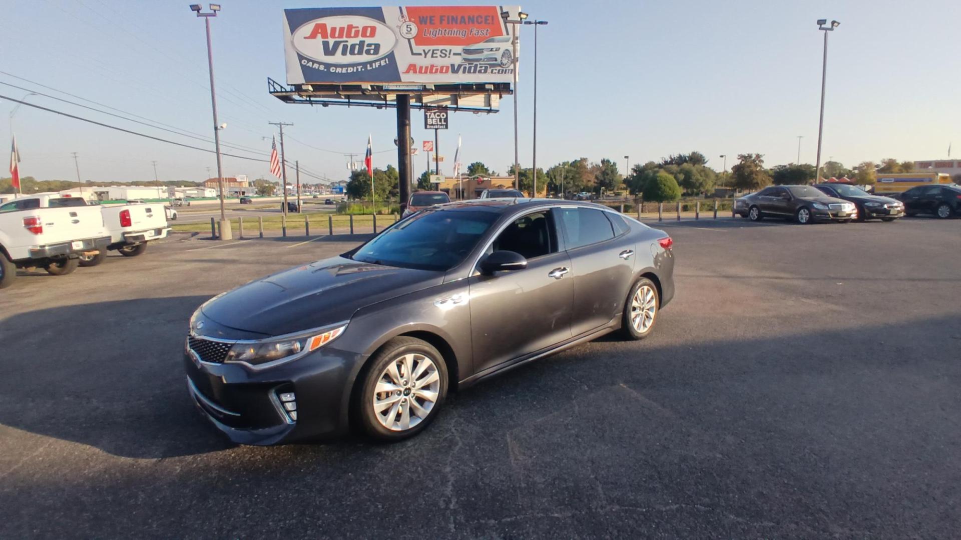 2018 GRAY Kia Optima LX (5XXGT4L32JG) with an 2.4L L4 DOHC 16V engine, 6A transmission, located at 420 I-35E, Lancaster, TX, 75146, (469) 297-4144, 32.593929, -96.823685 - Photo#0