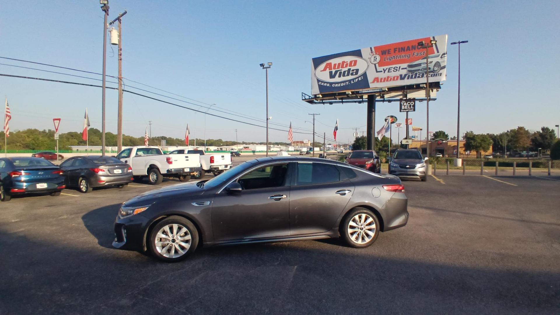 2018 GRAY Kia Optima LX (5XXGT4L32JG) with an 2.4L L4 DOHC 16V engine, 6A transmission, located at 420 I-35E, Lancaster, TX, 75146, (469) 297-4144, 32.593929, -96.823685 - Photo#1