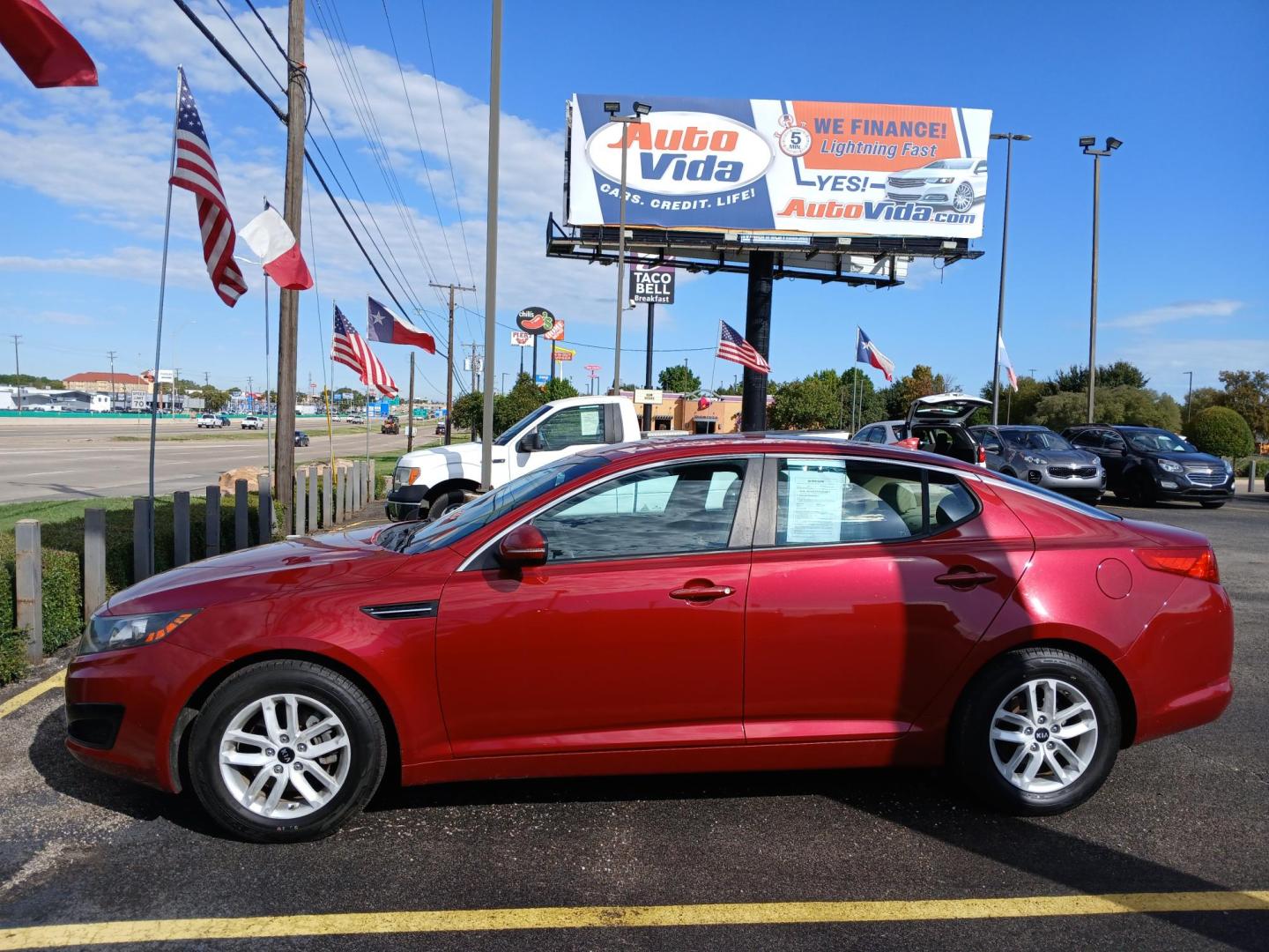 2011 RED Kia Optima EX (KNAGM4A79B5) with an 2.4L L4 DOHC 16V engine, 6-Speed Automatic transmission, located at 420 I-35E, Lancaster, TX, 75146, (469) 297-4144, 32.593929, -96.823685 - Photo#1