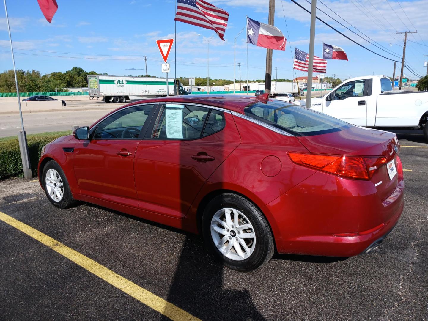 2011 RED Kia Optima EX (KNAGM4A79B5) with an 2.4L L4 DOHC 16V engine, 6-Speed Automatic transmission, located at 420 I-35E, Lancaster, TX, 75146, (469) 297-4144, 32.593929, -96.823685 - Photo#2