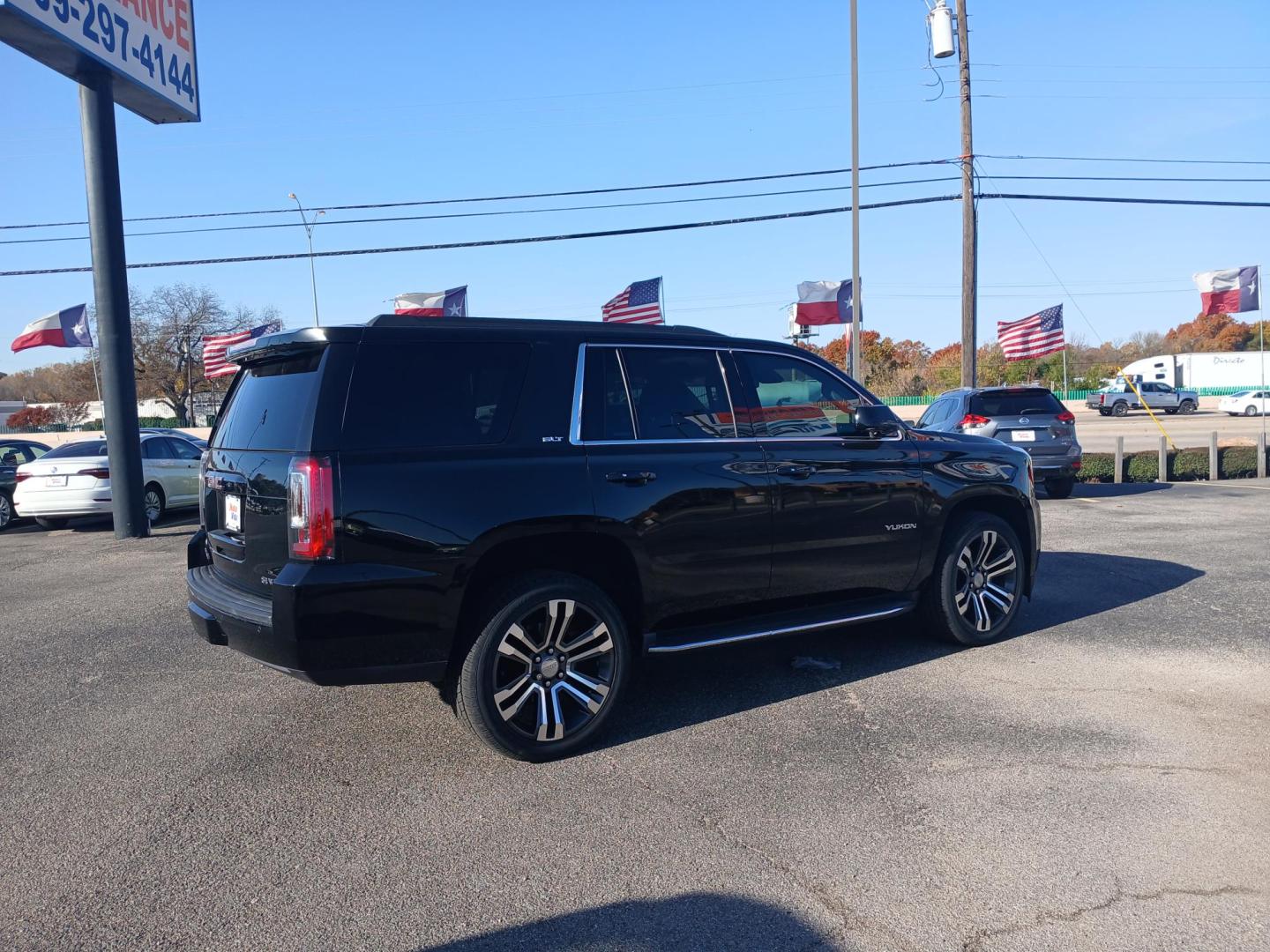 2017 BLACK GMC Yukon SLT 2WD (1GKS1BKC8HR) with an 5.3L V8 OHV 16V engine, 6A transmission, located at 420 I-35E, Lancaster, TX, 75146, (469) 297-4144, 32.593929, -96.823685 - Photo#2