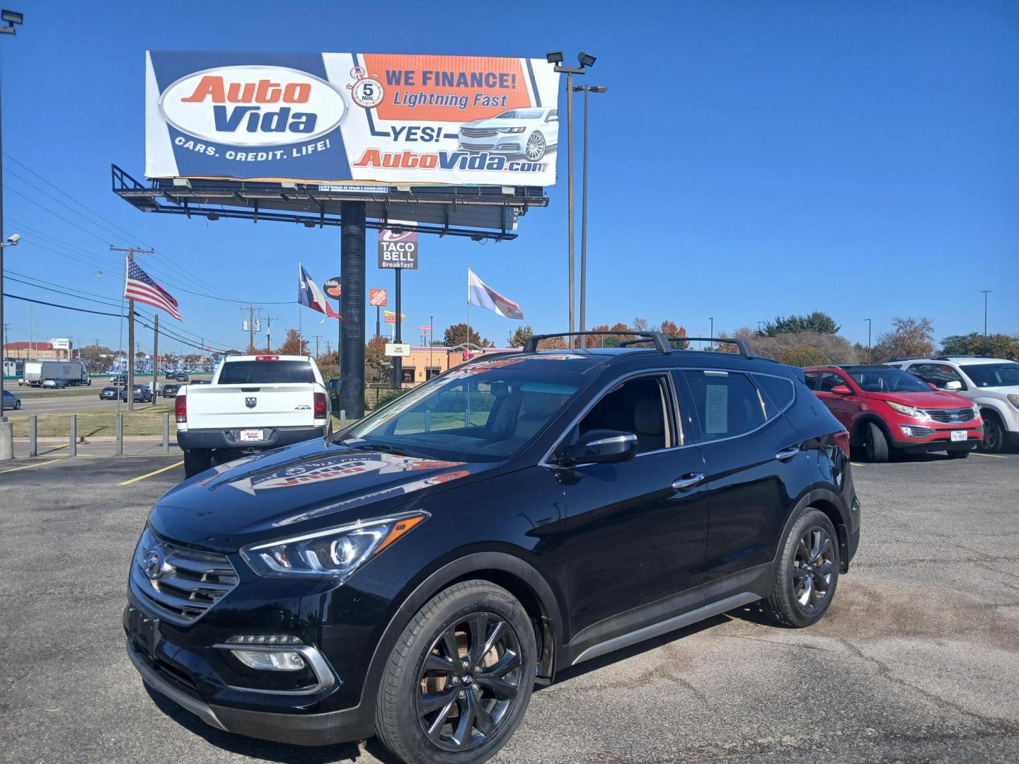 2017 BLACK Hyundai Santa Fe Sport 2.0T FWD (5XYZW4LA7HG) with an 2.0L L4 DOHC 16V TURBO engine, 6A transmission, located at 420 I-35E, Lancaster, TX, 75146, (469) 297-4144, 32.593929, -96.823685 - Photo#0