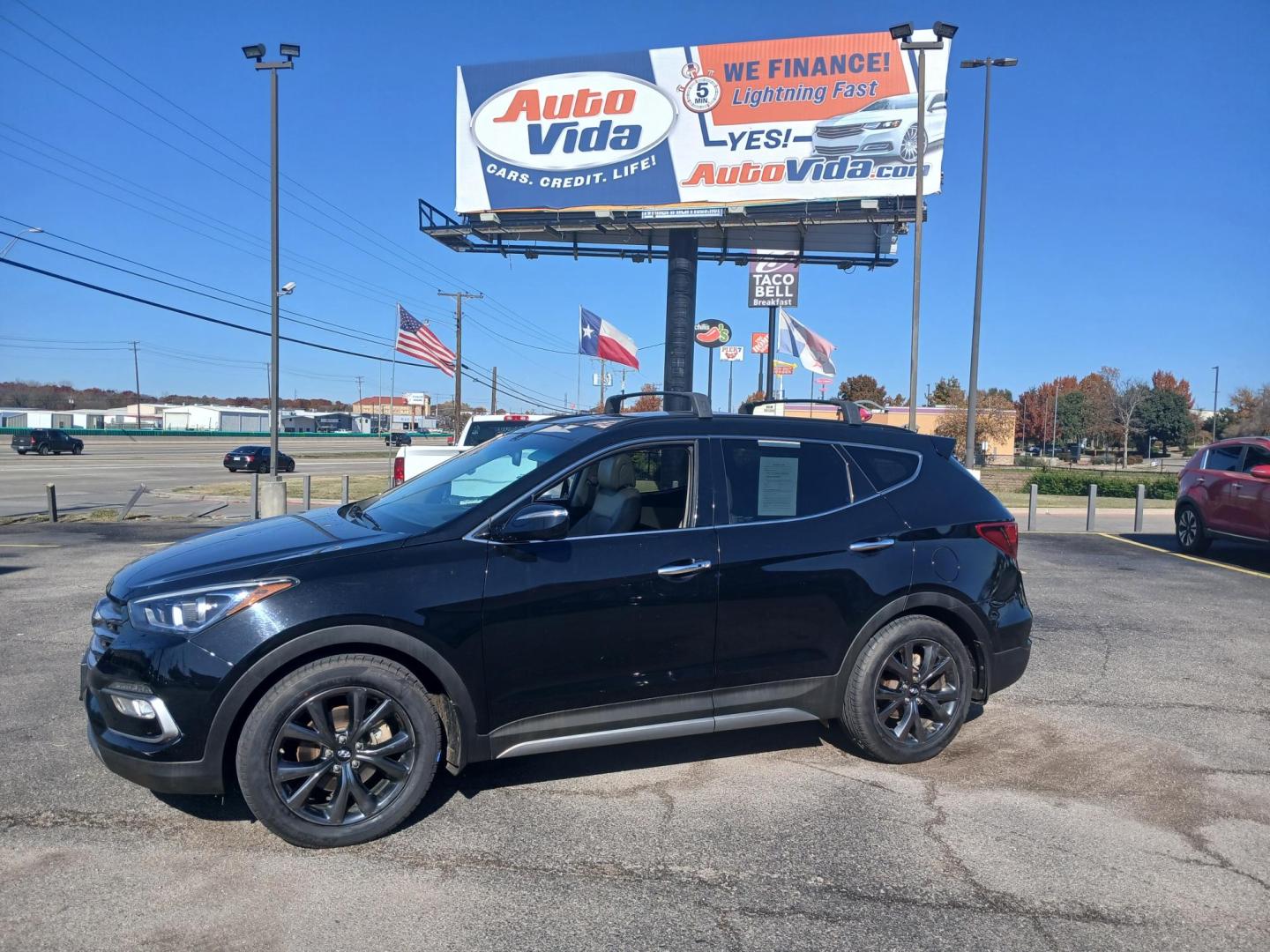 2017 BLACK Hyundai Santa Fe Sport 2.0T FWD (5XYZW4LA7HG) with an 2.0L L4 DOHC 16V TURBO engine, 6A transmission, located at 420 I-35E, Lancaster, TX, 75146, (469) 297-4144, 32.593929, -96.823685 - Photo#1