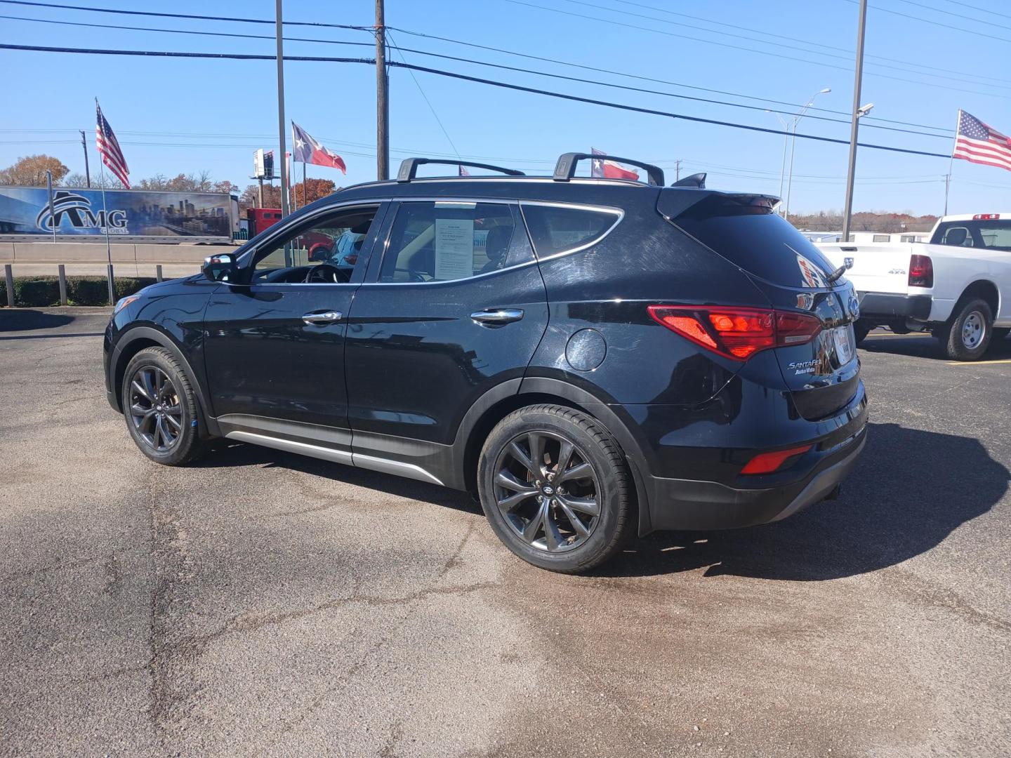 2017 BLACK Hyundai Santa Fe Sport 2.0T FWD (5XYZW4LA7HG) with an 2.0L L4 DOHC 16V TURBO engine, 6A transmission, located at 420 I-35E, Lancaster, TX, 75146, (469) 297-4144, 32.593929, -96.823685 - Photo#2