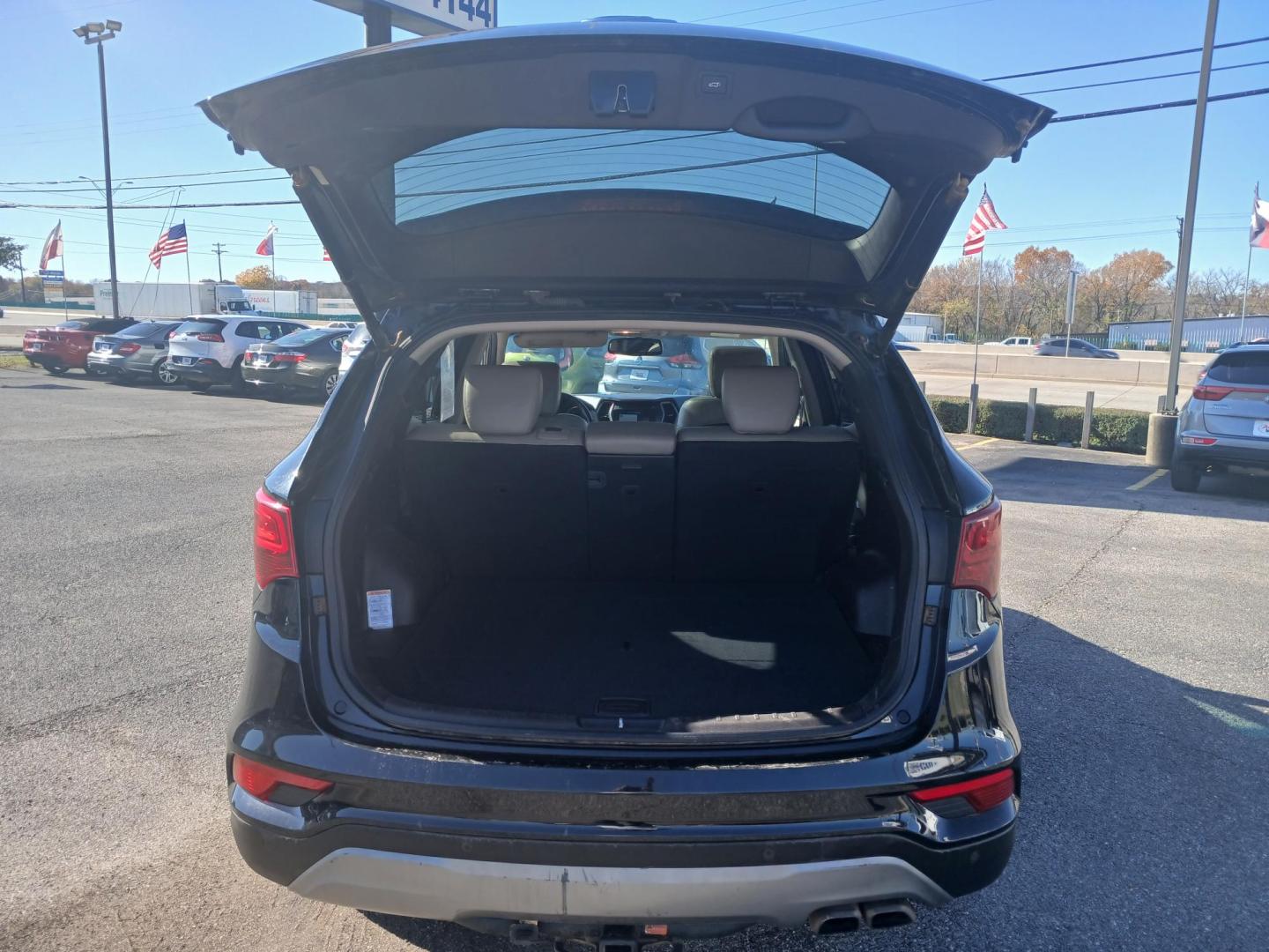 2017 BLACK Hyundai Santa Fe Sport 2.0T FWD (5XYZW4LA7HG) with an 2.0L L4 DOHC 16V TURBO engine, 6A transmission, located at 420 I-35E, Lancaster, TX, 75146, (469) 297-4144, 32.593929, -96.823685 - Photo#5