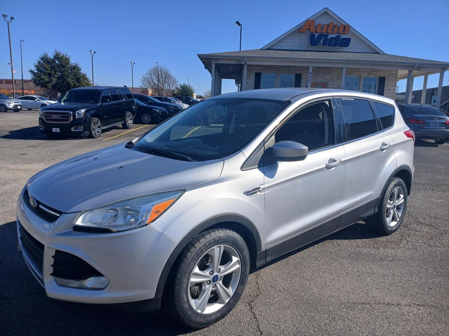 2014 SILVER Ford Escape SE FWD (1FMCU0GX7EU) with an 1.6L L4 DOHC 16V engine, 6-Speed Automatic transmission, located at 420 I-35E, Lancaster, TX, 75146, (469) 297-4144, 32.593929, -96.823685 - Photo#0