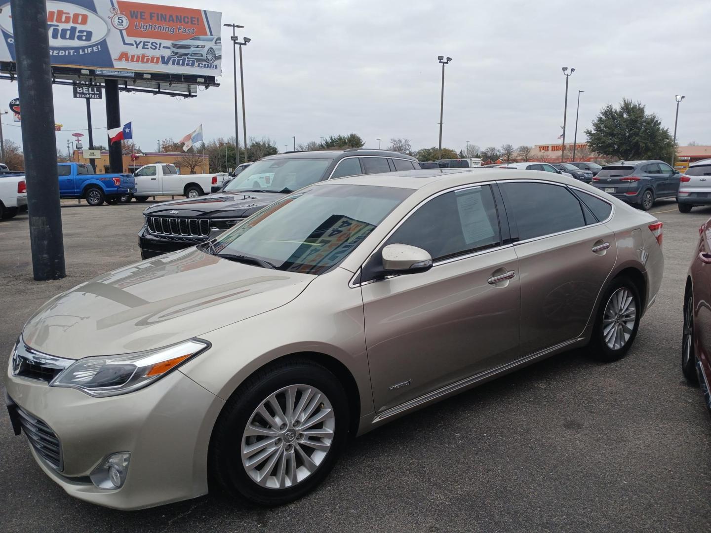 2015 TAN Toyota Avalon Hybrid XLE Premium (4T1BD1EB8FU) with an 2.5L L4 DOHC 16V HYBRID engine, Continuously Variable Transmission transmission, located at 420 I-35E, Lancaster, TX, 75146, (469) 297-4144, 32.593929, -96.823685 - Photo#0