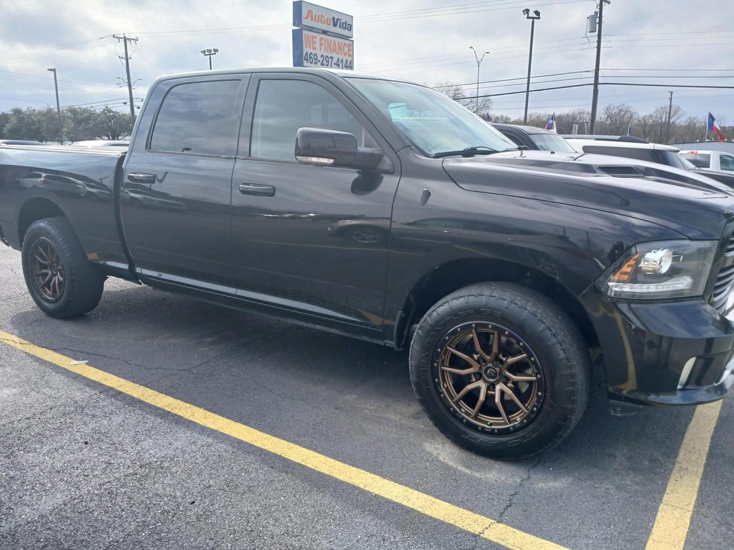 2016 BLACK RAM 1500 Sport Crew Cab LWB 4WD (1C6RR7UT5GS) with an 5.7L V8 OHV 16V engine, 6A transmission, located at 420 I-35E, Lancaster, TX, 75146, (469) 297-4144, 32.593929, -96.823685 - Photo#0