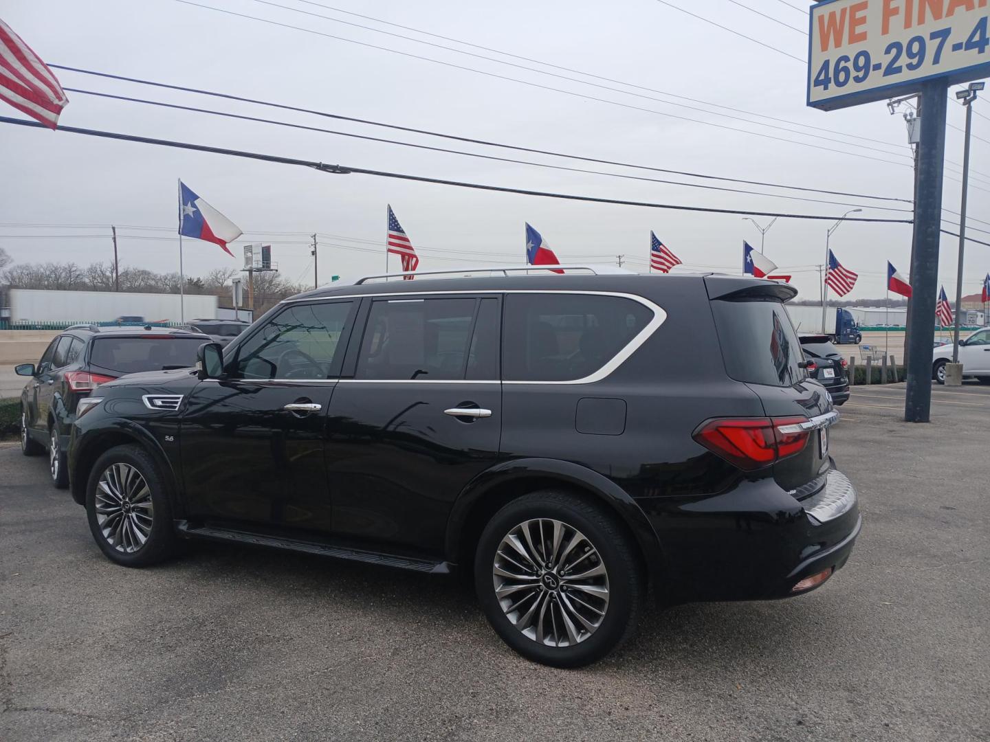 2018 BLACK Infiniti QX80 2WD (JN8AZ2NF5J9) with an 5.6L V8 DOHC 32V engine, 7A transmission, located at 420 I-35E, Lancaster, TX, 75146, (469) 297-4144, 32.593929, -96.823685 - Photo#2