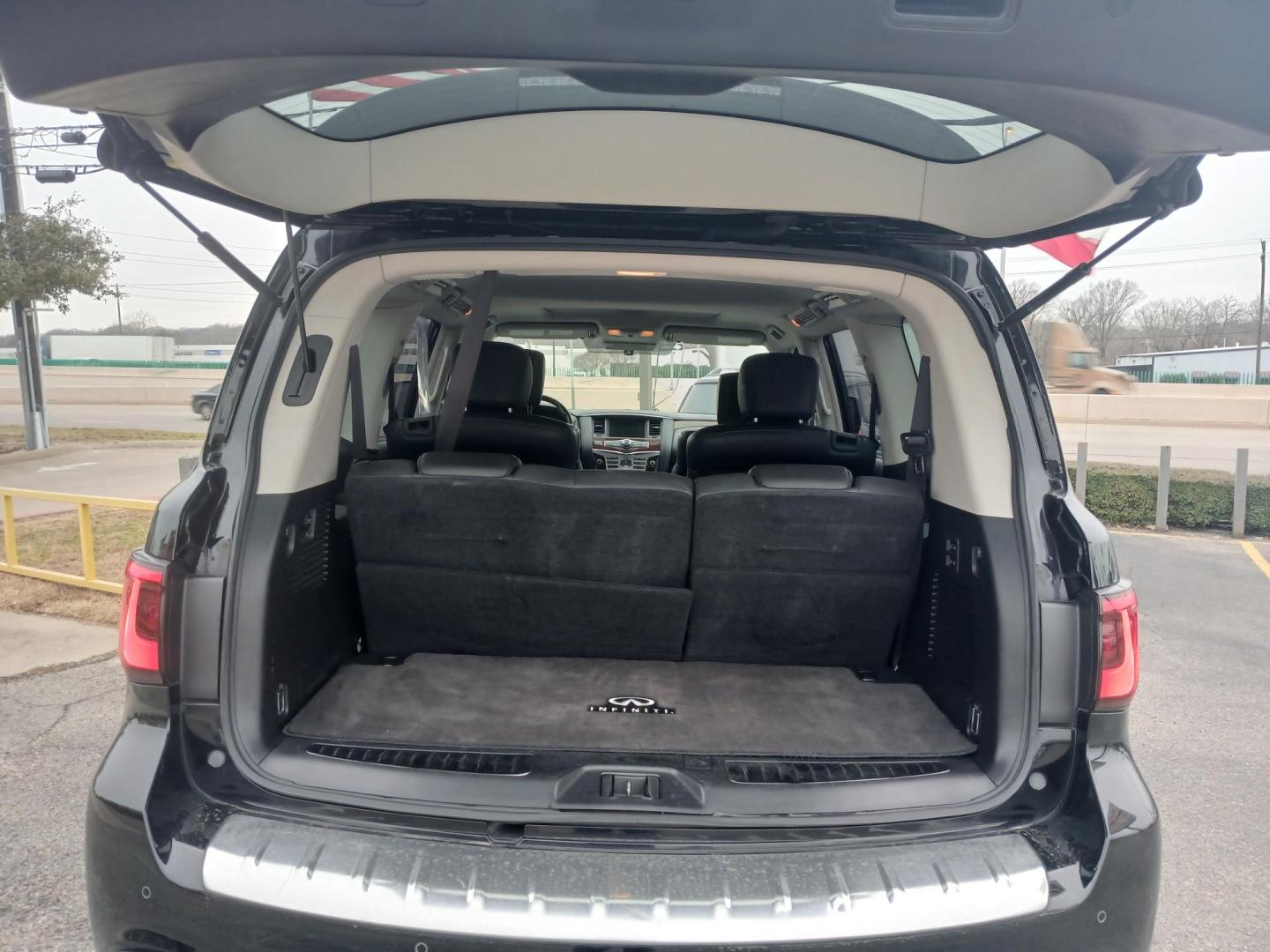 2018 BLACK Infiniti QX80 2WD (JN8AZ2NF5J9) with an 5.6L V8 DOHC 32V engine, 7A transmission, located at 420 I-35E, Lancaster, TX, 75146, (469) 297-4144, 32.593929, -96.823685 - Photo#3