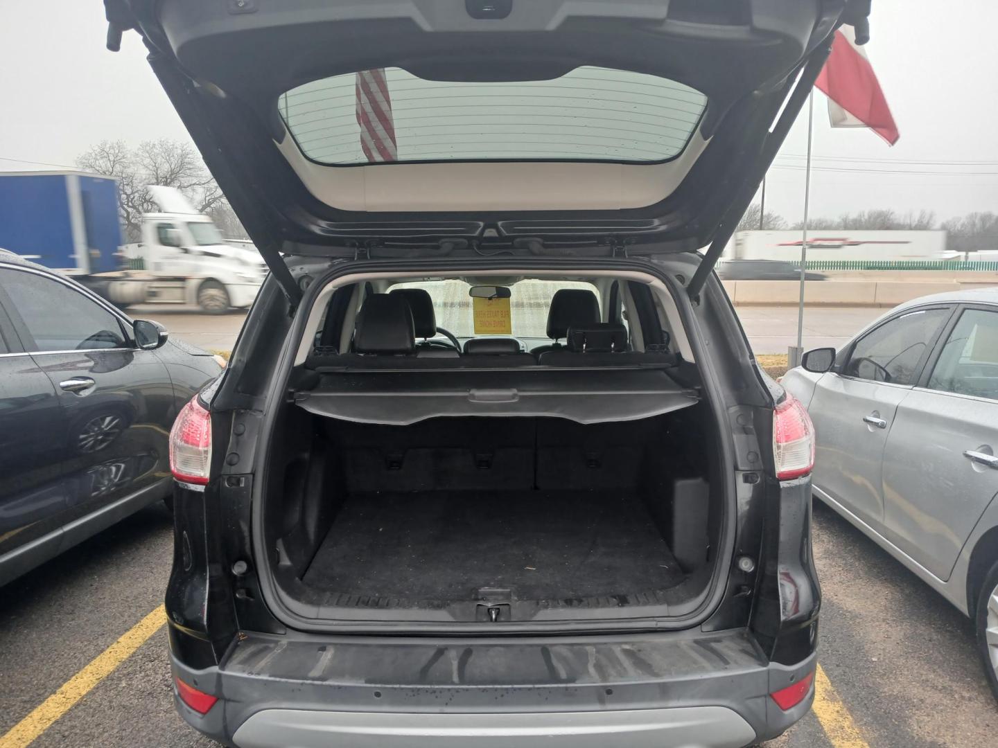 2015 BLACK Ford Escape SE FWD (1FMCU0GX8FU) with an 1.6L L4 DOHC 16V engine, 6-Speed Automatic transmission, located at 420 I-35E, Lancaster, TX, 75146, (469) 297-4144, 32.593929, -96.823685 - Photo#2