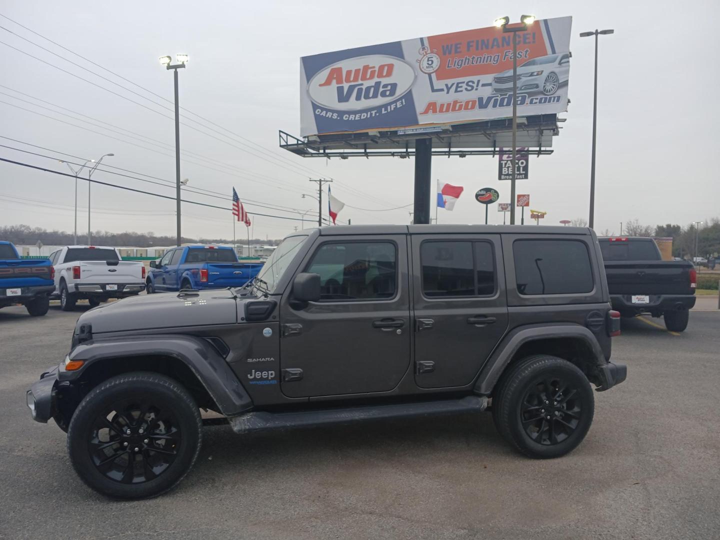 2021 GRAY Jeep Wrangler Unlimited Sahara 4XE (1C4JJXP60MW) with an 2.0L L4 DOHC 16V HYBRID engine, 8A transmission, located at 420 I-35E, Lancaster, TX, 75146, (469) 297-4144, 32.593929, -96.823685 - Photo#1