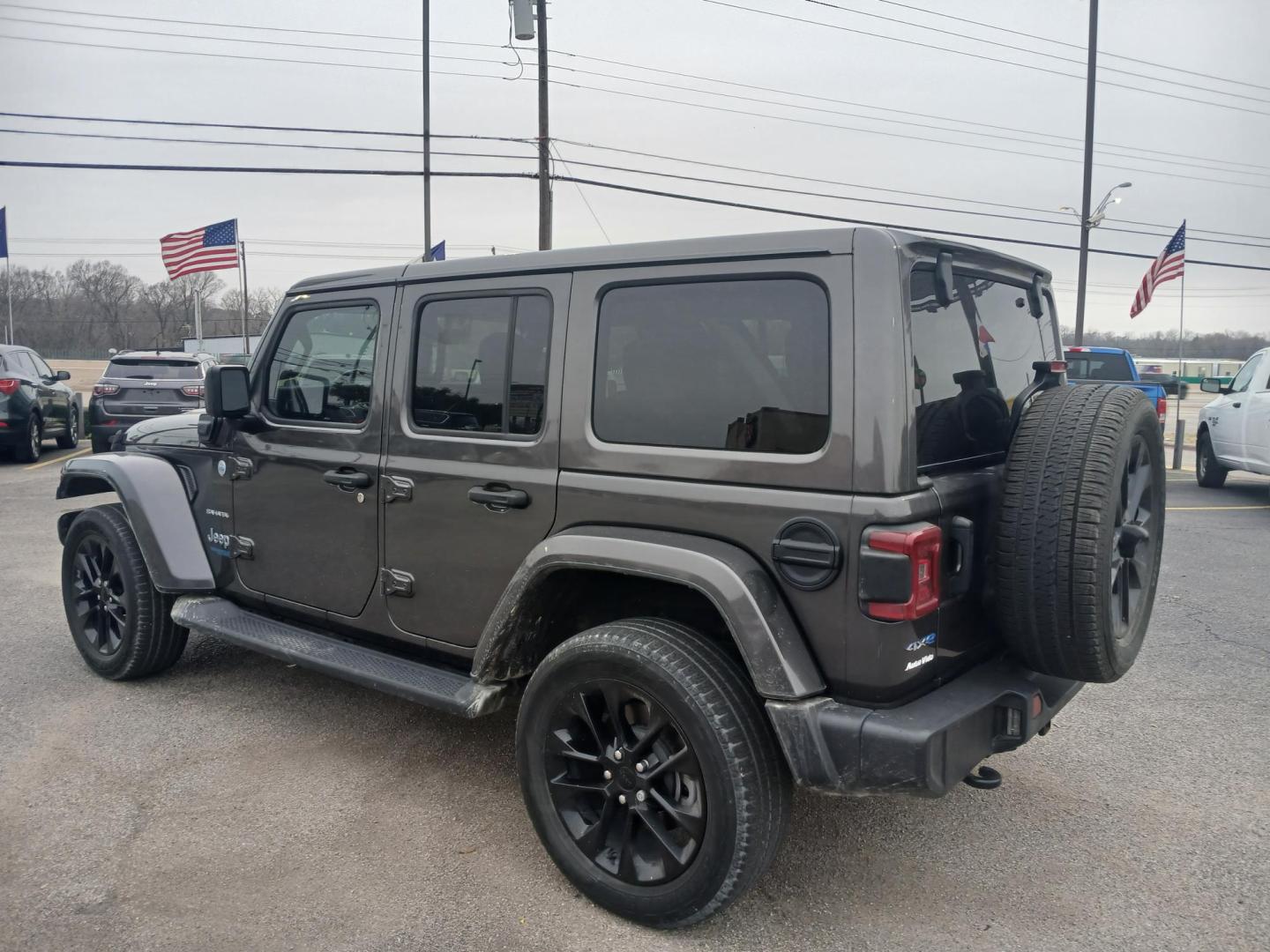 2021 GRAY Jeep Wrangler Unlimited Sahara 4XE (1C4JJXP60MW) with an 2.0L L4 DOHC 16V HYBRID engine, 8A transmission, located at 420 I-35E, Lancaster, TX, 75146, (469) 297-4144, 32.593929, -96.823685 - Photo#2